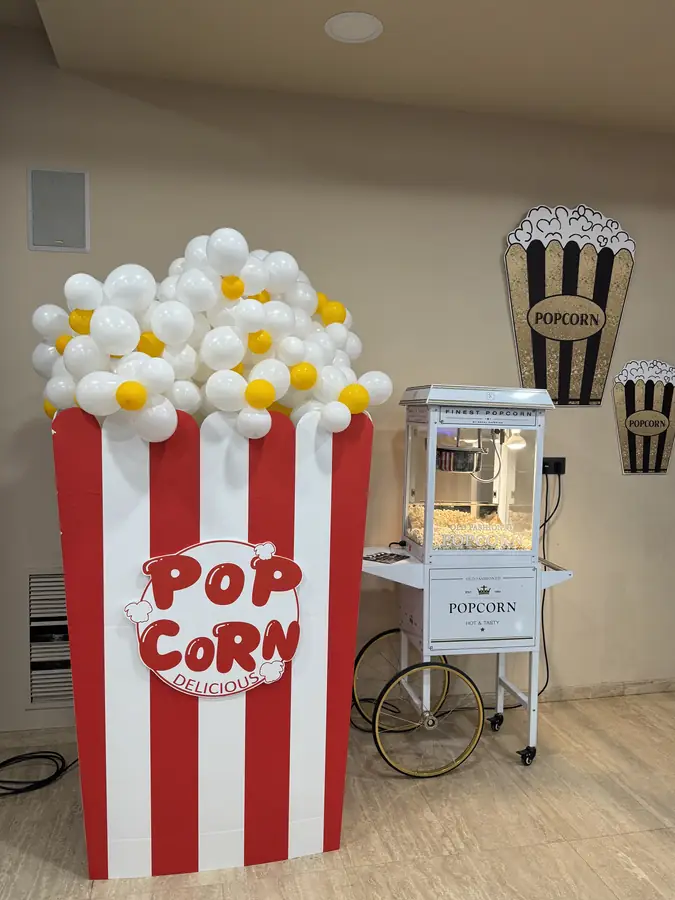 Vintage popcorn cart styled for a cinema-themed gala
