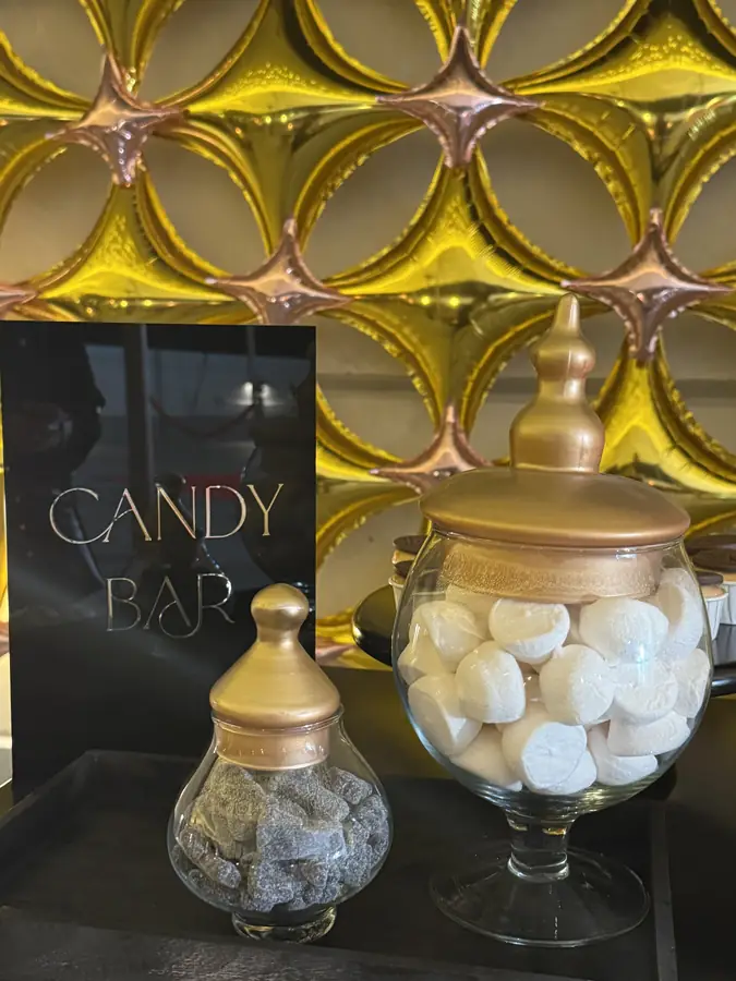 Blue grand piano beside a candy bar corner