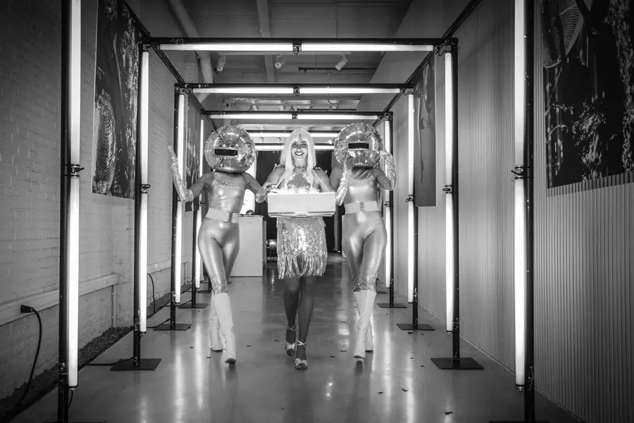 Corridor of mirrors and neon light, in black and white