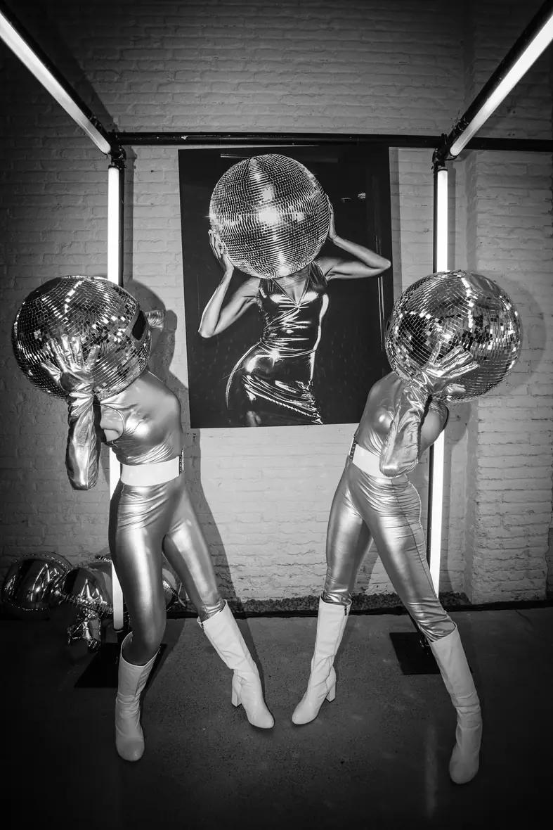 Mirror-costumed performers in black and white at a private 40th birthday