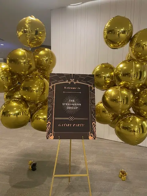 Gold balloon photocall welcoming guests to the Straumann Group luxury party