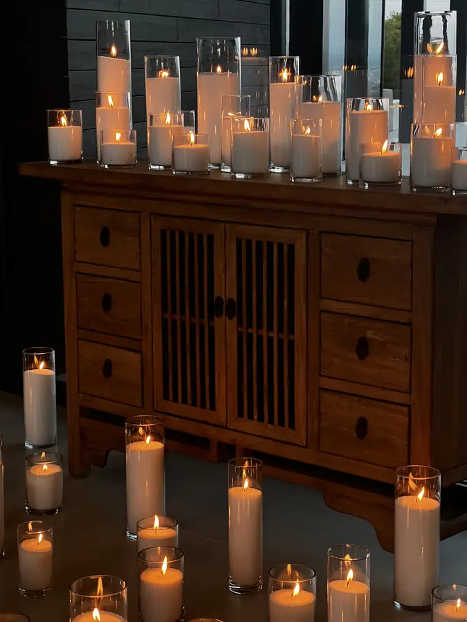 Gilded console dressed with candles in a candlelit villa