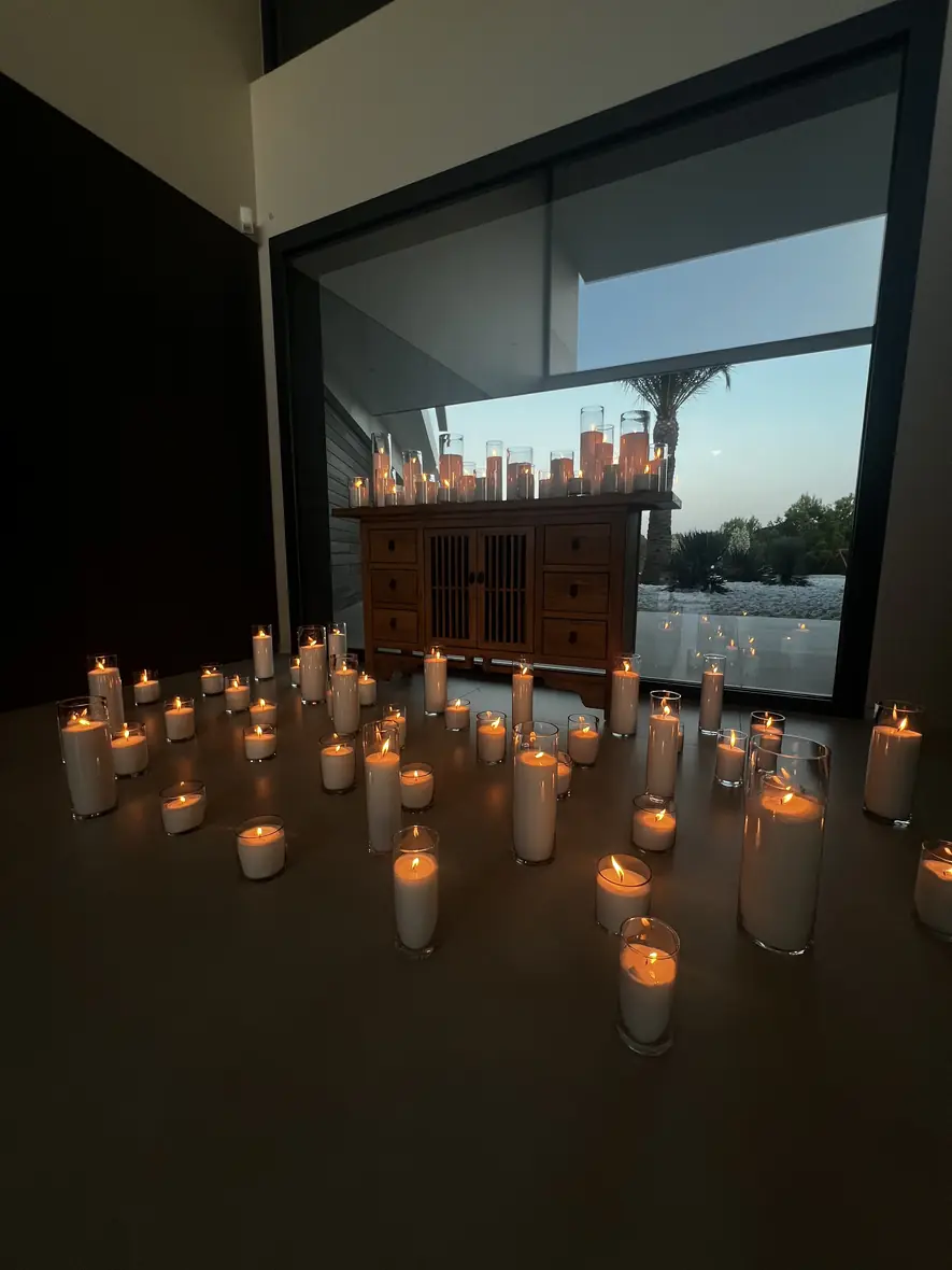 Candlelit modern villa interior with floor-to-ceiling windows